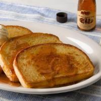 French Toast · Four slices of our Sourdough bread, grilled and topped with butter. Plus 100% Pure Natural S...