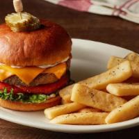 The Barrel Cheeseburger* · Our juicy grilled to order patty is seasoned and seared on our flat top grill, topped with m...