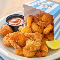 Crispy Rockin' Shrimp · Fried Shrimp with a side of Steak Fries, a hushpuppy and cocktail sauce. Served with a Butte...