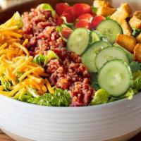 House Salad · Fresh greens with Thick-Sliced Bacon pieces, diced tomato and cucumber blend, shredded Colby...
