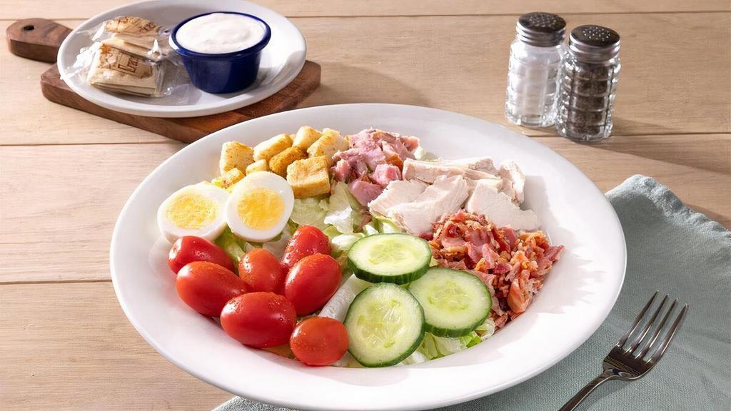 Chef Salad · Our fresh salad greens are topped with our own Oven Roasted Turkey Breast, pieces of Sugar Cured Ham and bacon, cucumbers, grape tomatoes, house-baked Sourdough croutons, and boiled eggs plus Westminster Crackers..