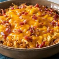Loaded Hashbrown Casserole · Our Hashbrown Casserole grilled and topped with Colby Cheese, and bacon pieces. Packed hot a...
