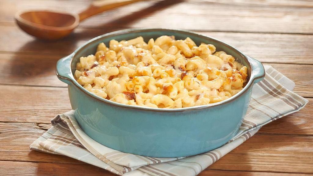 Macaroni N' Cheese  · Elbow Macaroni Noodles mixed with cheese and baked in the oven for our signature Macaroni n' Cheese. Packed hot and ready to serve..