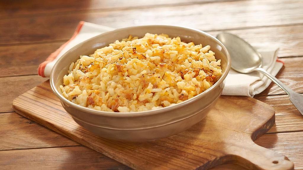 Hashbrown Casserole  · Shredded potatoes, Colby cheese, chopped onions, our signature seasoning blend, salt and pepper baked together in the oven for our Signature Hashbrown Casserole. Packed hot and ready to serve..