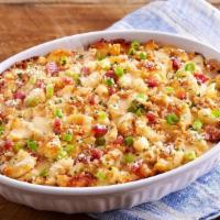 Bacon Mac N' Cheese · Our creamy macaroni n’ cheese comes topped with crispy bacon bites, parsley, green onions, a...