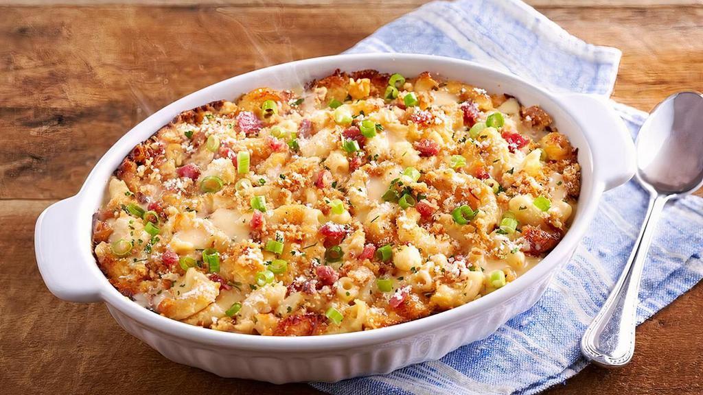 Bacon Mac N' Cheese · Our creamy macaroni n’ cheese comes topped with crispy bacon bites, parsley, green onions, and parmesan cheese..