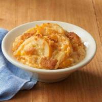 Three Cheese Squash Casserole · Baked yellow squash with a creamy cheese blend, topped with breadcrumbs.
