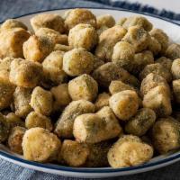 Fried Okra · Breaded Okra fired until golden brown. Packed hot and ready to serve..