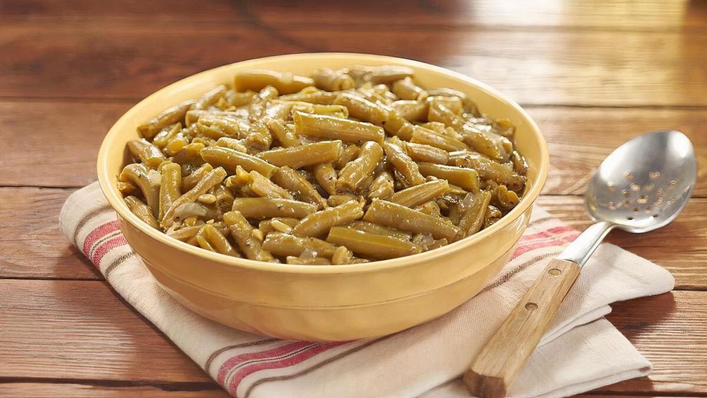 Green Beans  · Greens Beans slow simmered with a hint of pork seasoning. Packed hot and ready to serve. .