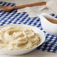 Mashed Potatoes W/Brown Gravy · Creamy Mashed Potatoes with Brown gravy. Packed hot and ready to serve..
