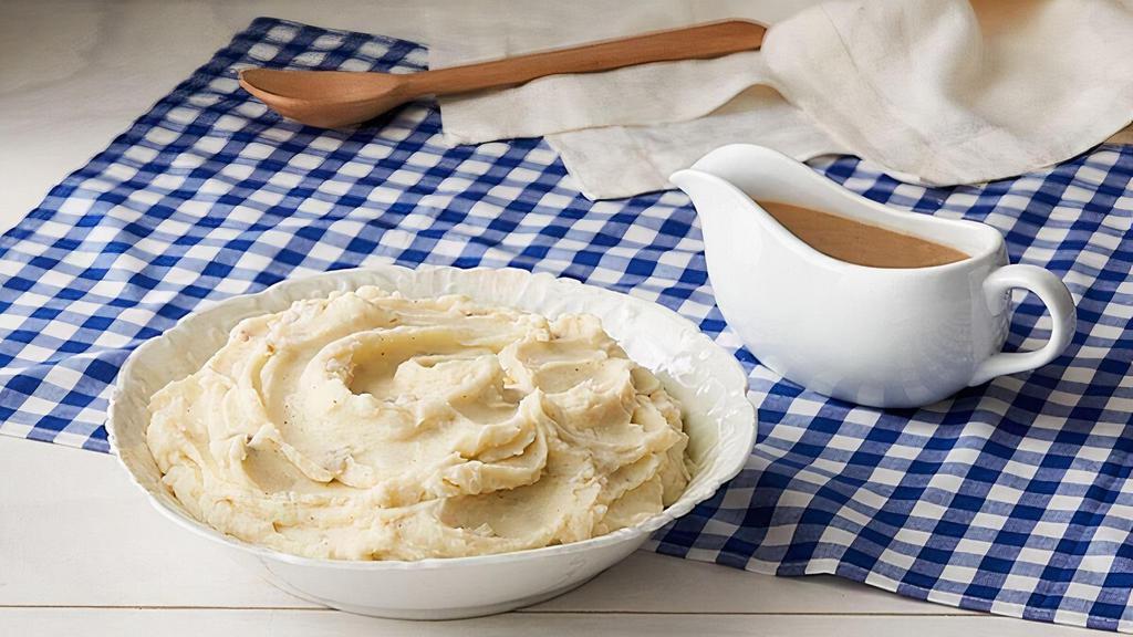 Mashed Potatoes W/Brown Gravy · Creamy Mashed Potatoes with Brown gravy. Packed hot and ready to serve..
