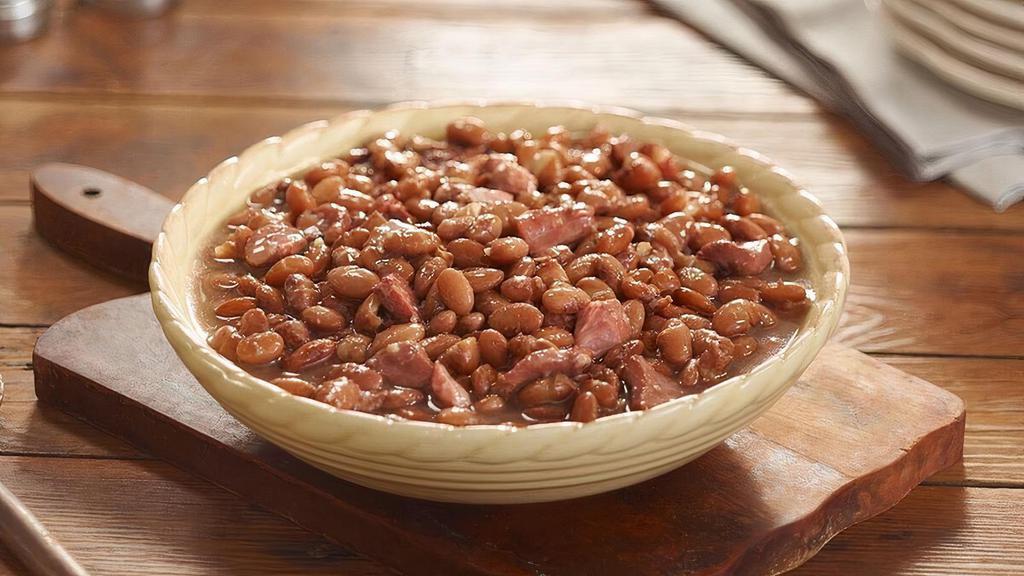 Pinto Beans  · Pinto Beans slow simmered with a hint of pork seasoning. Packed hot and ready to serve..