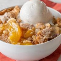 Fruit Cobbler · Made with seasonal fruit and served with Rich, Creamy Vanilla Ice Cream..
