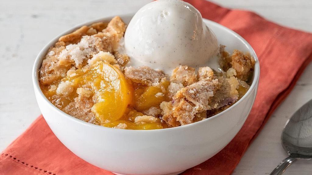 Fruit Cobbler · Made with seasonal fruit and served with Rich, Creamy Vanilla Ice Cream..
