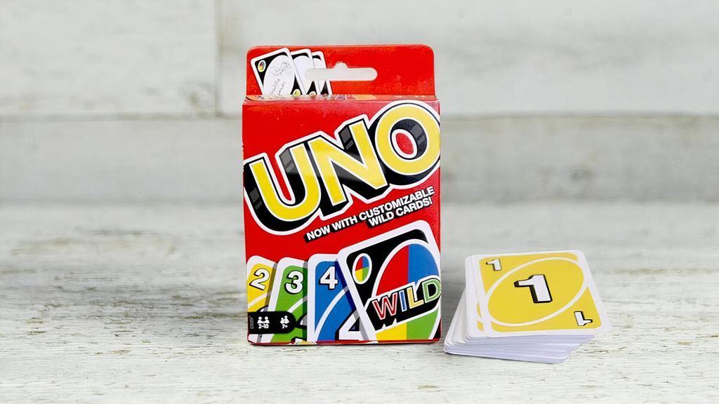 Uno · Uno is the classic card game that's easy to pick up and impossible to put down. The instruction guide included features options for tournaments, partner or two-handed play in addition to the original game.