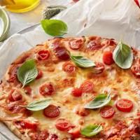 Margherita Pizza  · Mozzarella di bufala, tomatoes, basil, olive oil.