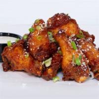 Chipotle Honey Wings · Chipotle honey glazed chicken wings topped with cotija cheese & scallions; served with miso ...