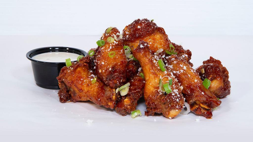 Chipotle Honey Wings · Chipotle honey glazed chicken wings topped with cotija cheese & scallions; served with miso ranch or blue cheese dressing.
