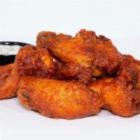 Haus Wings · Chicken wings tossed in sriracha buffalo sauce; served with miso blue cheese or Miso Ranch