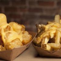 Cheese Fries · Seasoned fries with Haus cheese sauce