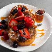 French Toast Breakfast · 4 slices of French toast topped with fresh fruit, maple syrup, and whipped cream.