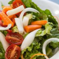 House Salad · Mixed greens, tomatoes, onions, cucumber, carrots, garbanzo beans, and choice of dressing.