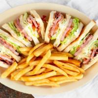 Club Sandwich W/Fries · Club sandwich with fries and 20oz drink.