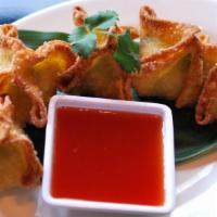 Crab Rangoon · Burmese-style fried cream cheese crab puff served with sweet & sour sauce.  Recipe includes ...