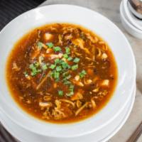 Hot & Sour Soup Bowl · A Bistro favorite with Tender Chicken, bamboo, Wood Ear Mushroom and Flowered egg & sesame O...