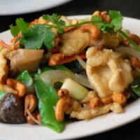 Cashew Chicken · Stir-fried with snow peas, shiitake mushrooms, green and yellow onions and cashews.  Recipe ...