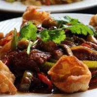 Genghis Khan Beef · Stir-fry flank steak, fresh jalapeno and mushrooms with crispy shrimp and pork won tons.  Re...