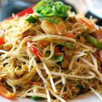 Singapore Noodles · Stir-fried rice noodles with shrimp, barbecued pork, egg, and Singaporean style curry.  Reci...