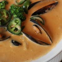 Thai Seafood Fat Pot · Shrimp, scallops, mussels, fish, broccoli, pineapple carrots in a rich coconut red curry broth