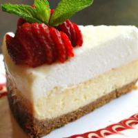 New York Style Cheesecake · Served with a fresh berry coulis.  Recipe includes dairy, wheat and eggs