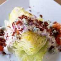 Wedge Salad · Iceberg Wedge, Blue Cheese Crumbles, Cherry Tomatoes, Red Onion, Bacon, & Blue Cheese Dressi...