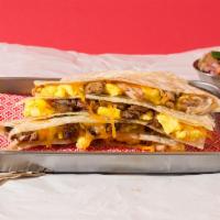 Breakfast Quesadilla · Your choice of carnitas, chorizo, or Asada with eggs and melted cheese on a tortilla. It com...