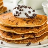 3 Fluffy Chocolate Chip · Fresh fluffy pancakes stuffed with chocolate chips with a side of syrup and butter.