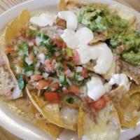 Veggie Nachos · Chips, beans, cheese, sour cream, guacamole & salsa.