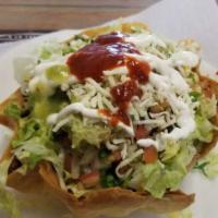 Taco Salad · Choice of meat, rice, beans, lettuce, cheese, sour cream, guacamole & salsa.