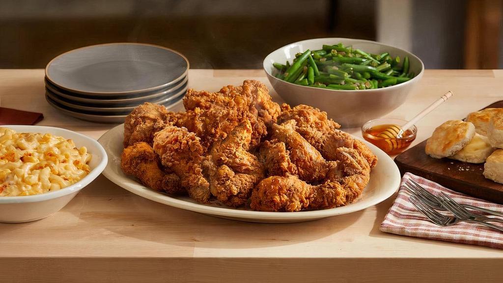 Southern Fried Chicken Bucket · 12 generous pieces of chicken, hand-breaded with our signature seasoning, perfectly crispy on the outside, perfectly juicy on the inside. Comes with honey for drizzling, two large sides, and hand rolled Buttermilk Biscuits. .