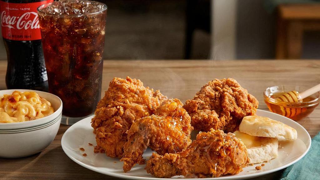 Southern Fried Chicken Box · Four generous pieces of chicken, hand-breaded with our signature seasoning, perfectly crispy on the outside, perfectly juicy on the inside. Comes with honey for drizzling, one side, and a hand rolled Buttermilk Biscuit. .