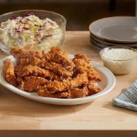 Hand-Breaded Fried Chicken Tenders Bucket · 16 tenders breaded by hand, fried until crispy, and served with your with choice of dipping ...