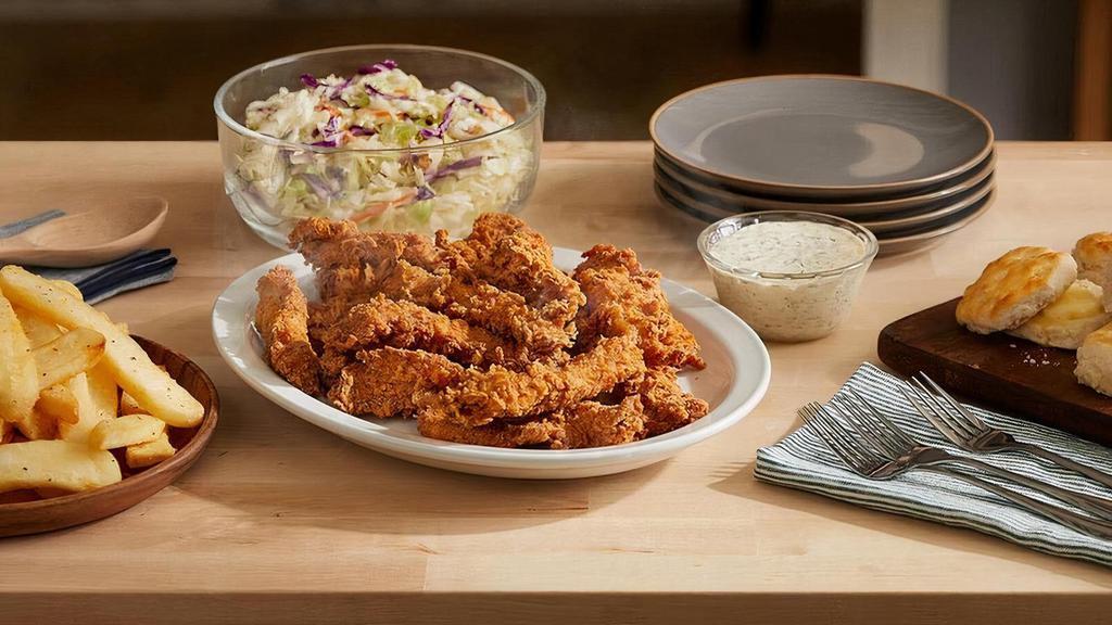 Hand-Breaded Fried Chicken Tenders Bucket · 16 tenders breaded by hand, fried until crispy, and served with your with choice of dipping sauce. Comes with two large sides, and hand rolled Buttermilk Biscuits.  .