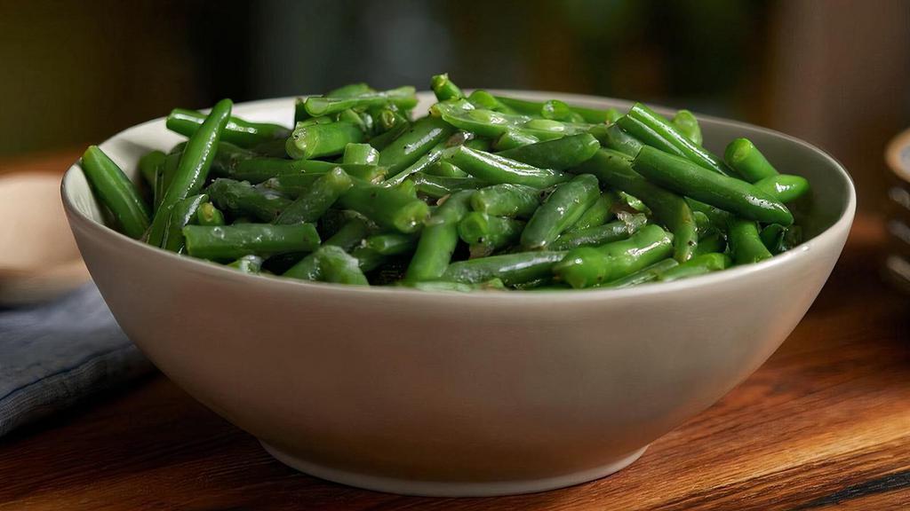 Green Beans (Large) · Homestyle green beans slow simmered with a hint of pork seasoning..
