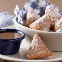 Biscuit Beignets · Our buttermilk biscuit dough, deep-fried then tossed in cinnamon sugar with butter pecan sau...