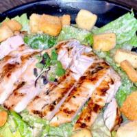 Chicken Caesar Salad · Grilled chicken breast, served with romaine, Parmesan cheese, croutons. Tossed with Caesar d...