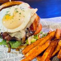 Metro Burger · 8oz Patty  100% sirloin beef topped with fried egg, bacon, avocado, caramelized onions, lett...