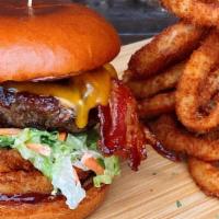 Bbq Western Burger · 8oz 100% Top Sirloin beef , Bacon, Onion Ring, Coleslaw, Cheddar Cheese And BBQ Sauce, on Br...