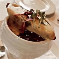 French Onion Soup · traditional beef stock with caramelized onion, gruyère cheese, giant herbed crouton