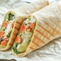 Grilled Chicken Pesto Wrap · Juicy grilled chicken, pesto, avocado, jack cheese, and mixed greens folded into wrap of cho...